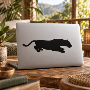 Panther pouncing decal, black silhouette on a light laptop lid