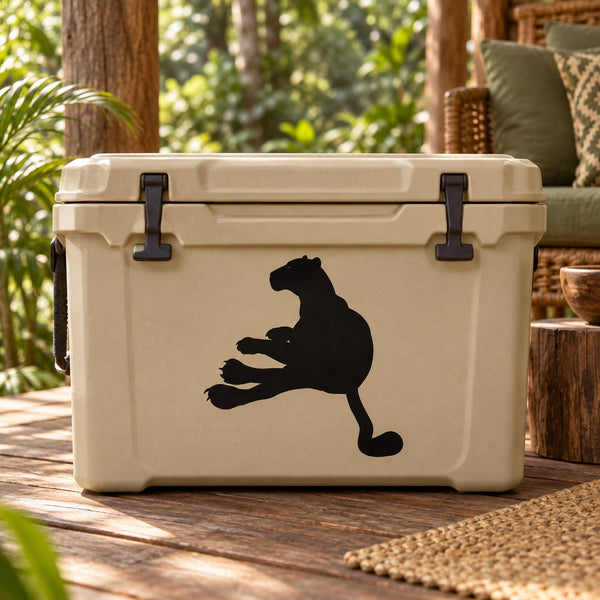 Reclining panther decal with solid black silhouette on a light cooler