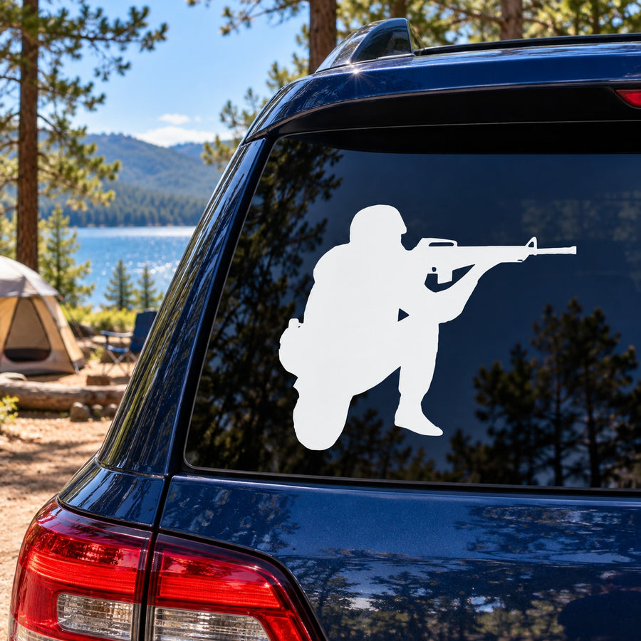 White soldier rifle decal on blue car rear window