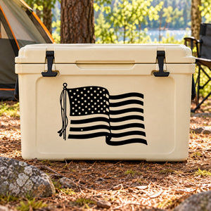 American flag decal on beige cooler lid with black tassel and waving stripes