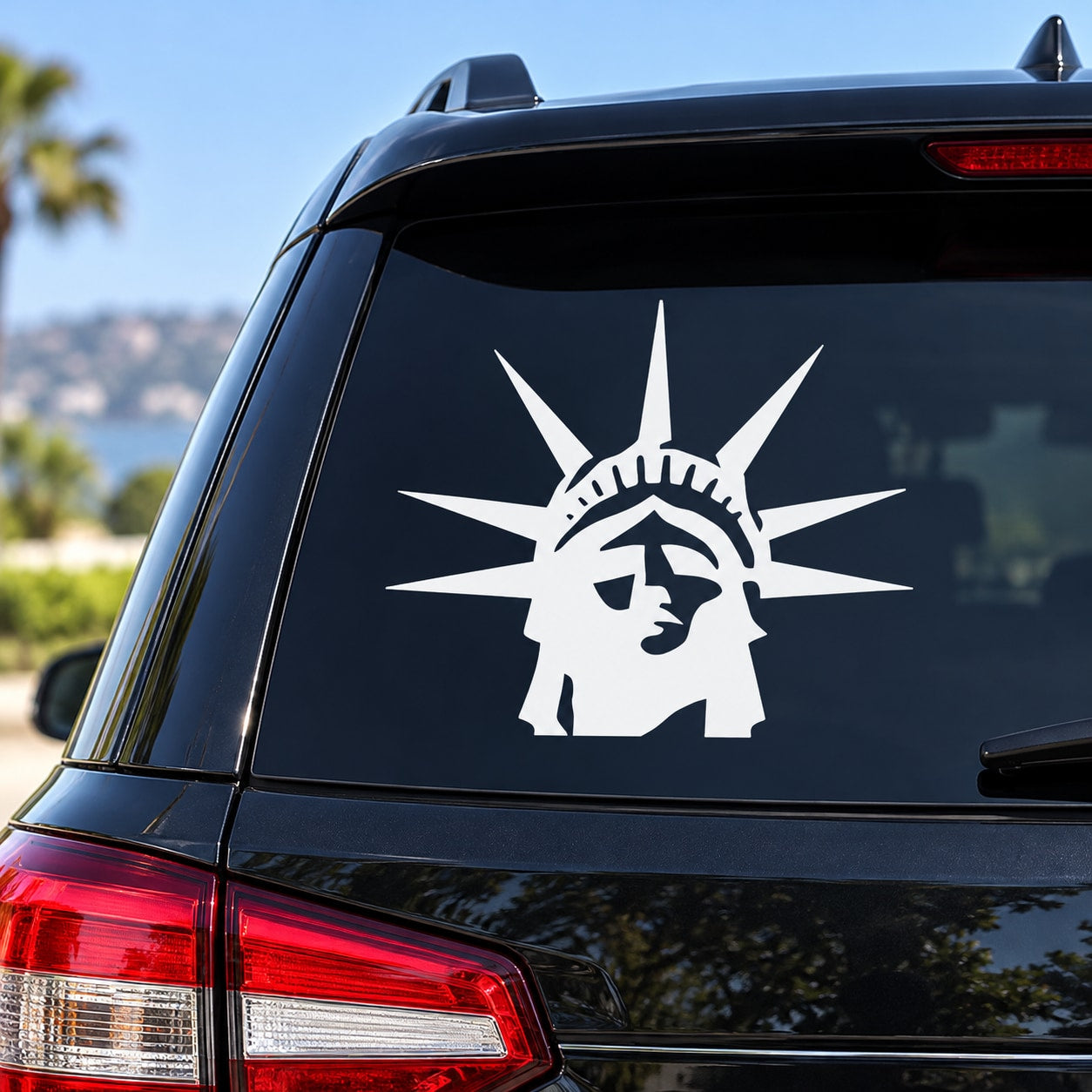White Statue of Liberty head decal on car window
