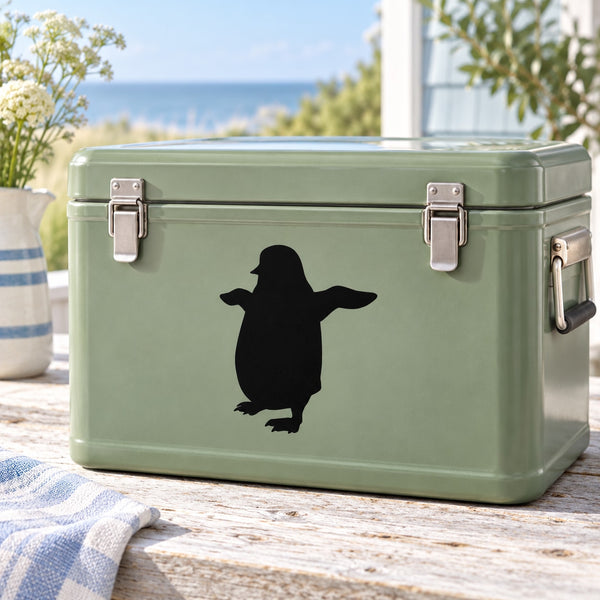 Green metal storage box with black penguin silhouette flapping decal