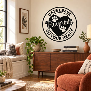 Wall decal with circular cat paw-print design and 'Cats Leave Pawprints on Your Heart' text