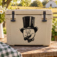 Beige hard cooler with cartoon pig in top hat and cigarette decal