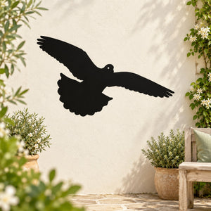 Black flying pigeon wall decal with spread wings and upward swoop