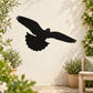 Black flying pigeon wall decal with spread wings and upward swoop