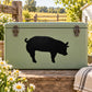 Black hunched standing pig decal silhouette on light green surface