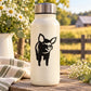 White bottle with black pig decal, metal lid