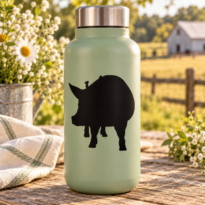 Mint green water bottle with black pig silhouette decal