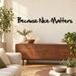 Wall decal with "Because Nice Matters" black script lettering