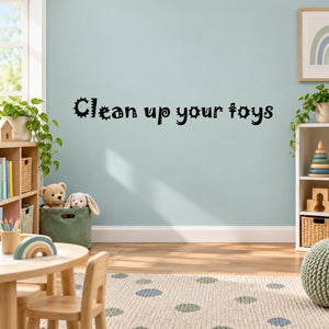 Black 'Clean up your toys' wall decal, chunky playful lettering.