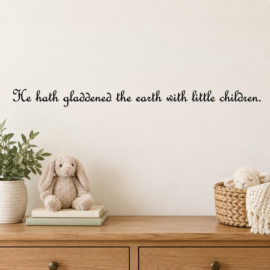 Wall decal with cursive quote: “He hath gladdened the earth with little children.”