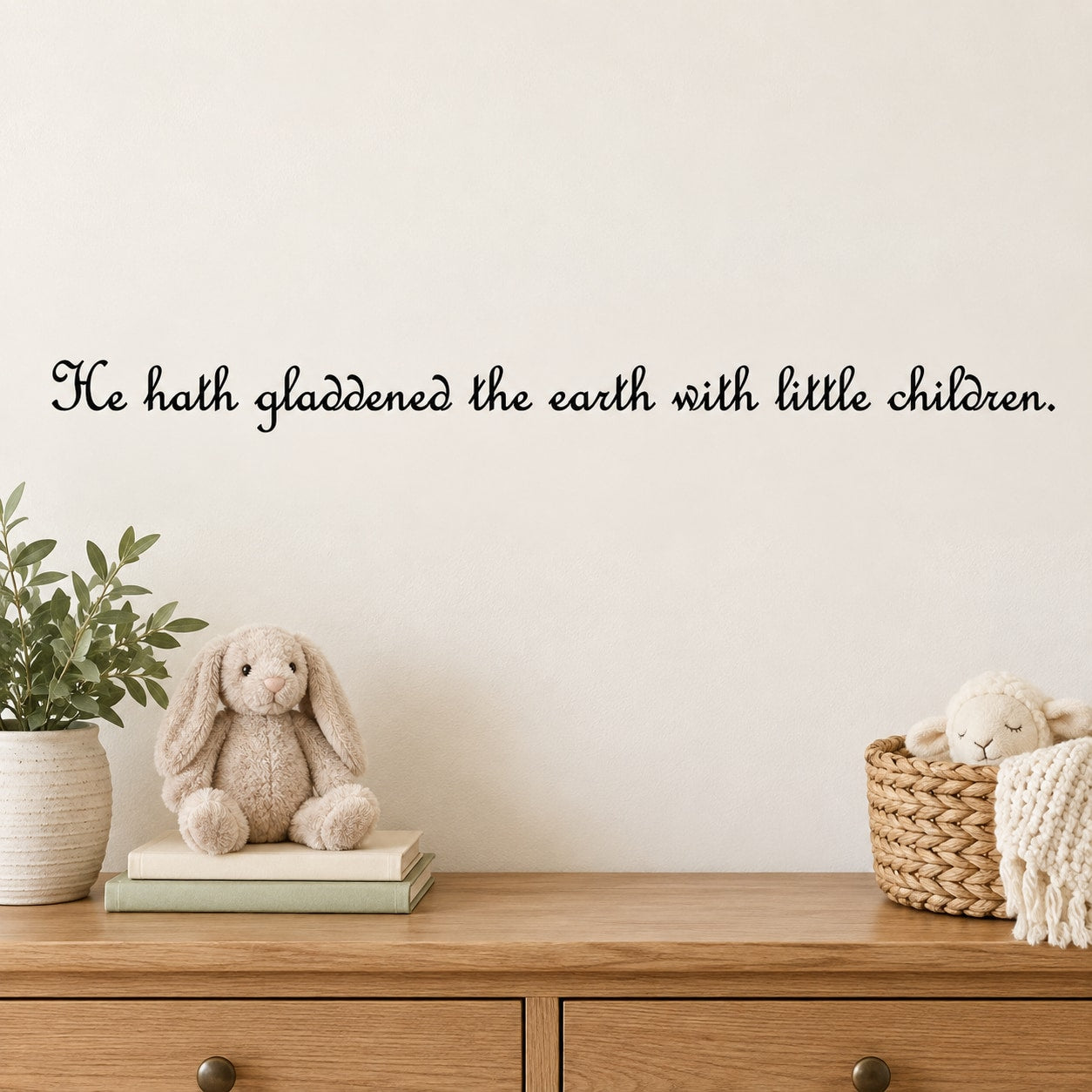 Wall decal with cursive quote: “He hath gladdened the earth with little children.”