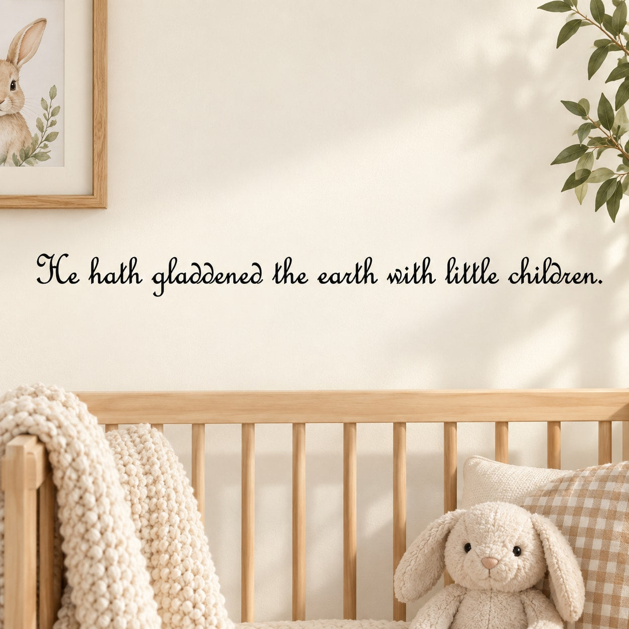 Wall decal with cursive quote: "He hath gladdened the earth with little children."