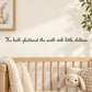 Wall decal with cursive quote: "He hath gladdened the earth with little children."