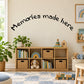 Wall decal with curved black lettering reading "Memories made here"