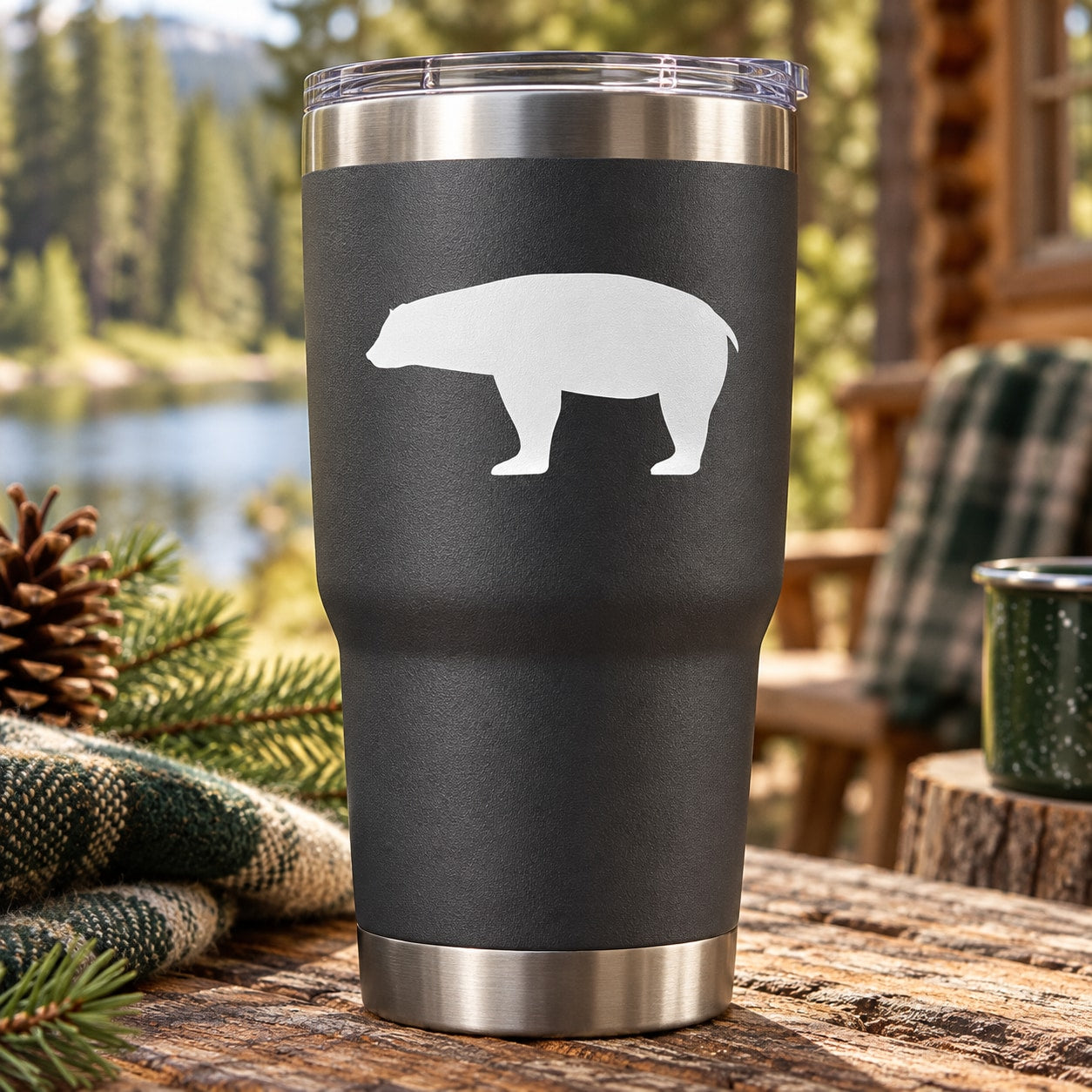 Polar bear silhouette decal on black insulated tumbler with clear lid