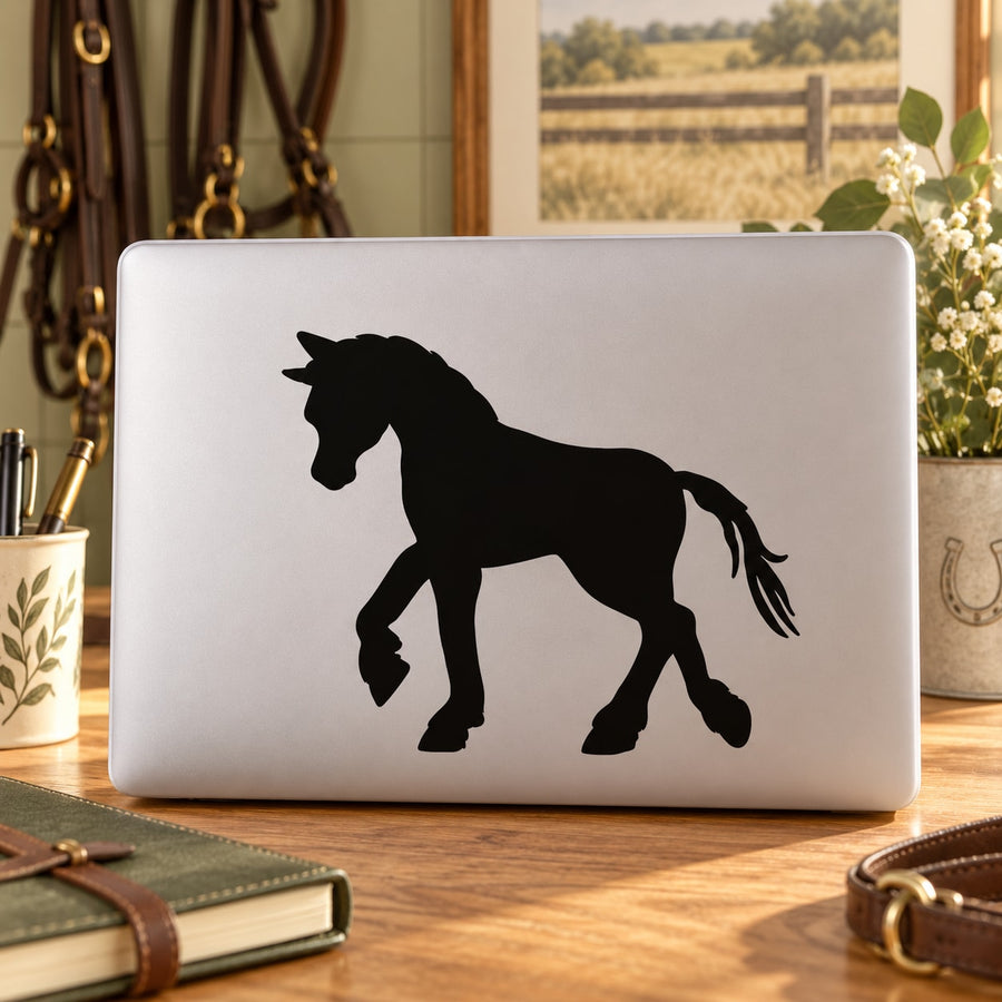Black strolling pony silhouette decal on a white laptop lid
