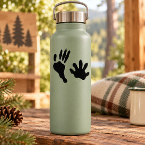 Light green water bottle with black paw print decal