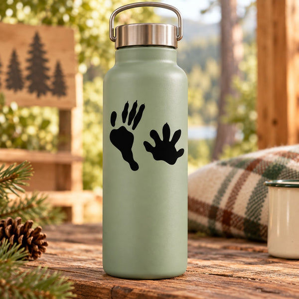 Light green water bottle with black paw print decal