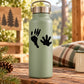 Light green water bottle with black paw print decal