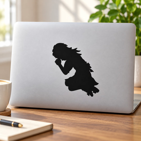Praying girl decal silhouette with bowed head on a laptop lid