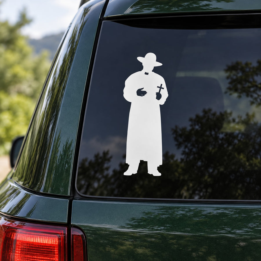 Roman Catholic priest decal with white silhouette holding a cross, on a car window
