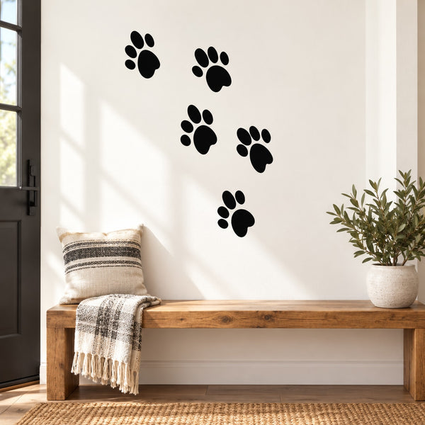 Dog paw print wall decal with five black paw designs