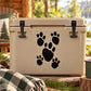 Black paw track decal with five paw prints on a tan cooler