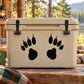 Mountain lion track-themed hard cooler, beige with paw-print graphics and snap latches