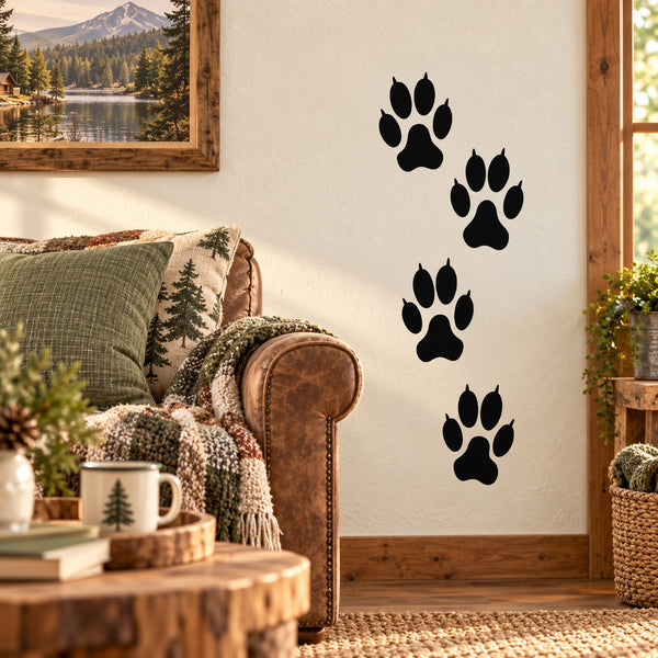 Black paw print wall decal set with four footprints