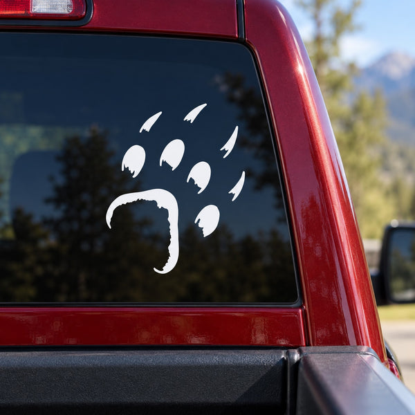 White bear paw print decal on car window glass