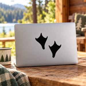 Black mallard duck decal set with two duck silhouettes on a white laptop lid