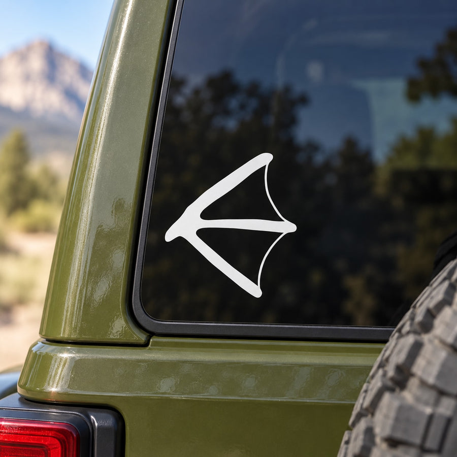 White duck track arrow decal on dark car window glass