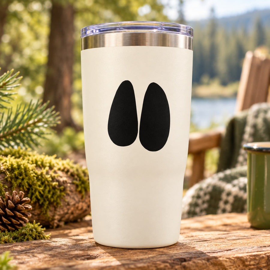 Wild deer track decal with two black oval footprints on a light-colored surface