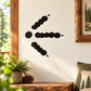 Black bird track decal with three paw prints and a beak-like mark
