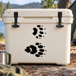 Raccoon track decal with two sets of black paw prints on a cooler