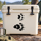 Raccoon track decal with two sets of black paw prints on a cooler