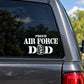 Air Force dad dog tags decal with “PROUD AIR FORCE” lettering on car window