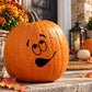 Orange pumpkin face decal with smiling eyes and curved grin, Halloween wall or window sticker