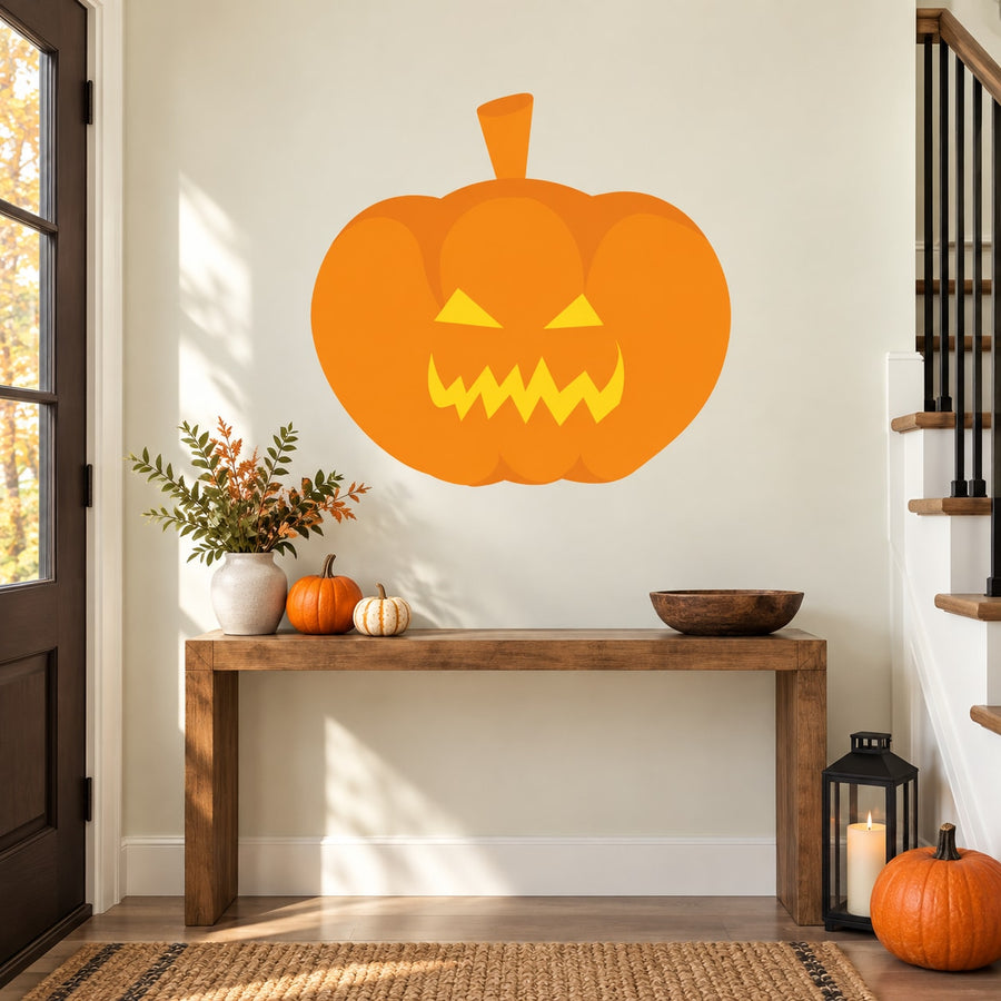 Orange jack-o-lantern sticker with jagged grin and triangle eyes