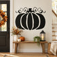 Black and white vine pumpkin wall decal with curly vines and small orange leaves