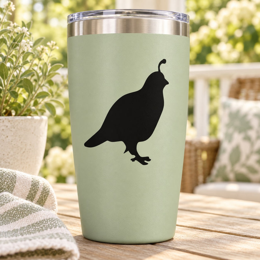 Stainless tumbler with black quail decal on pale green body