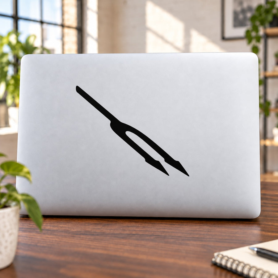 Black spike logo decal on white laptop lid