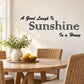 Wall decal quote: “A Good Laugh Is Sunshine in a House” in elegant script