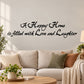 Cursive wall decal: 'A Happy Home is filled with Love and Laughter'