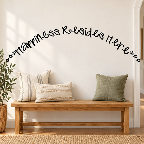 Wall decal with "happiness resides here" in black cursive lettering