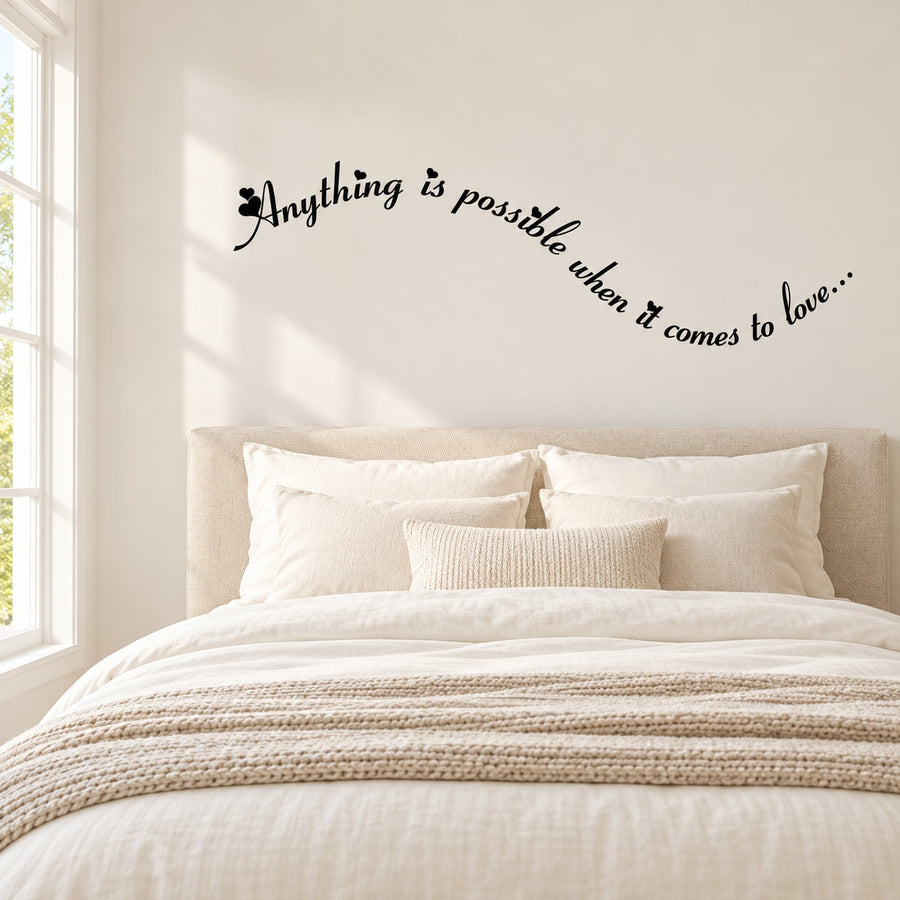 Cursive wall decal with black text, 'Anything is possible when it comes to love'