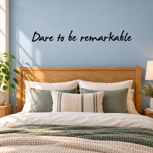 Wall decal with script text 'Dare to be remarkable'