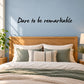 Wall decal with script text 'Dare to be remarkable'